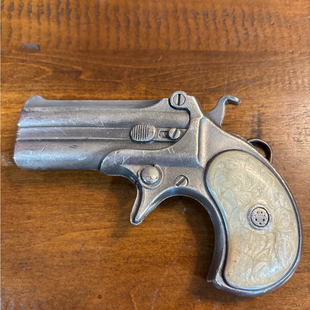 Vintage Silver and Cream Decorative Pistol belt buckle